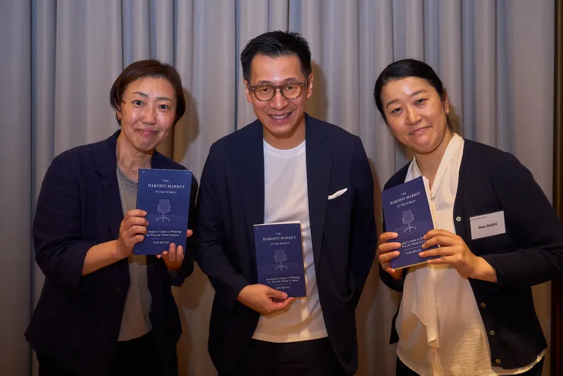 Yan Sen Lu with guests holding The Hardest Market at the launch
