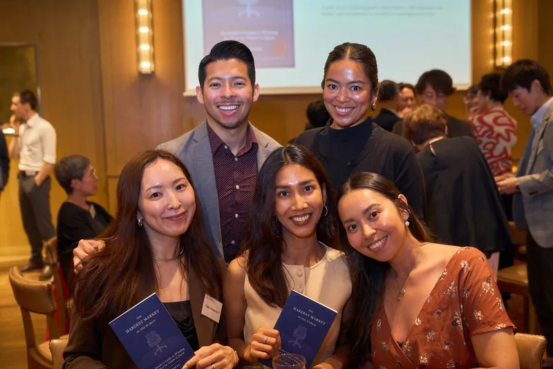 Group of guests with the book at the launch