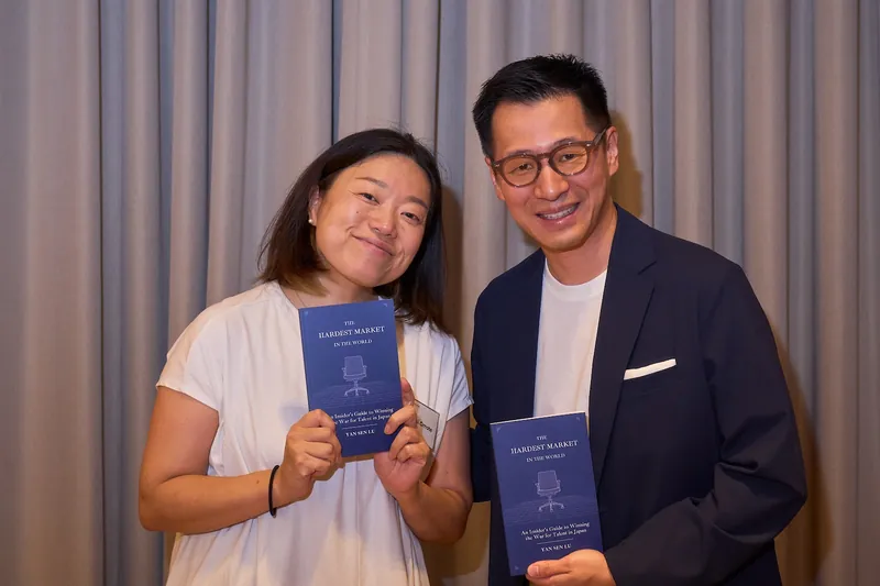 Yan Sen Lu with a guest and the book
