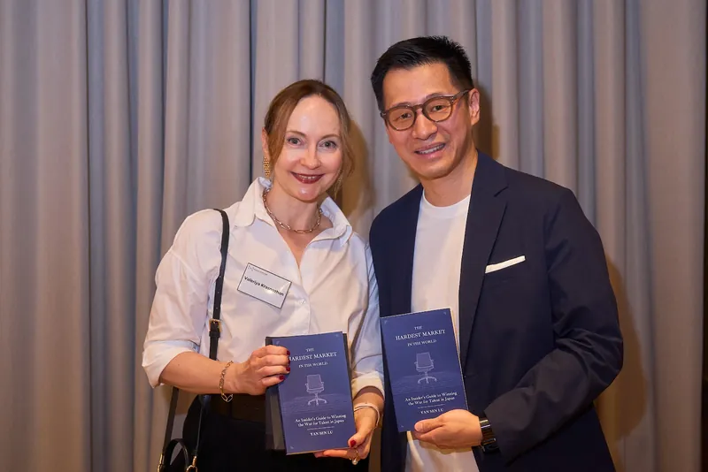 Yan Sen Lu with an international guest and the book