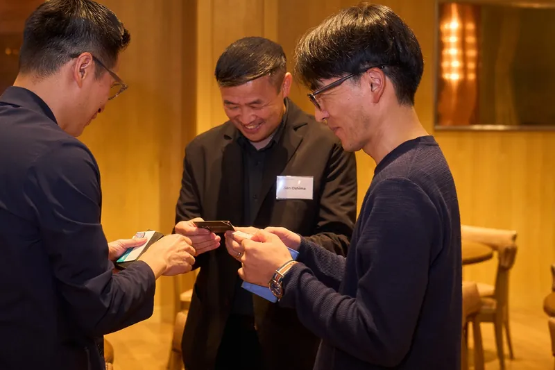 Guests exchanging business cards